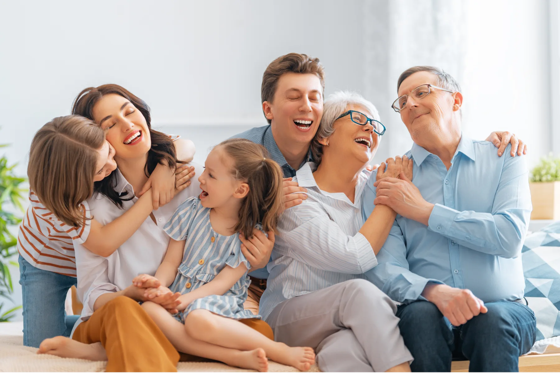 Multi-generational family laughing together — patients of Ottawa Dental Centre in Ottawa